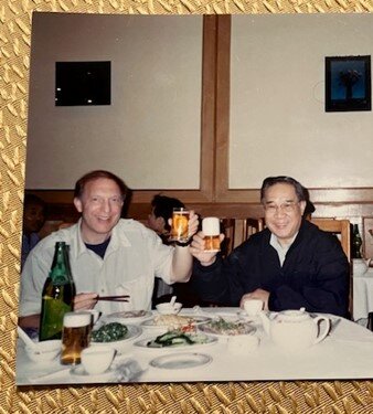 Enjoying a meal with Wang Xi, October 1994.