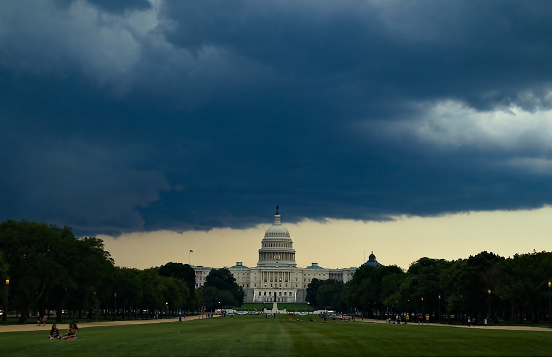 View of the capitol with storms on the horizon