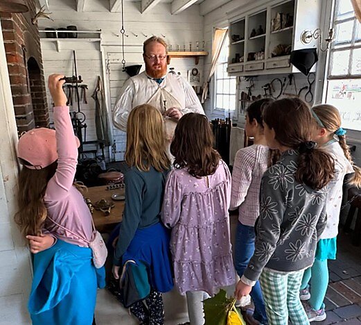 Scholé students visiting a founder.